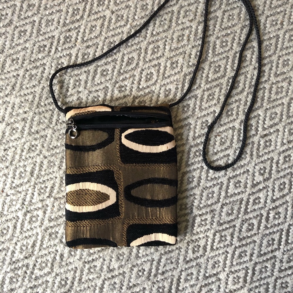 Beautiful small crossbody bag.  Black and gold fabric 6”x 7.5